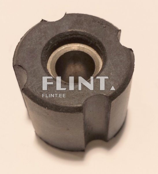 Ümar, tumedast materjalist detail, mille keskosas on metallist avaus. Detailil on ühtlaselt väga sile pind.