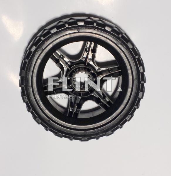 Must alusvanker, millel on keskel keeratud puuriosa ja kuus kiirt.