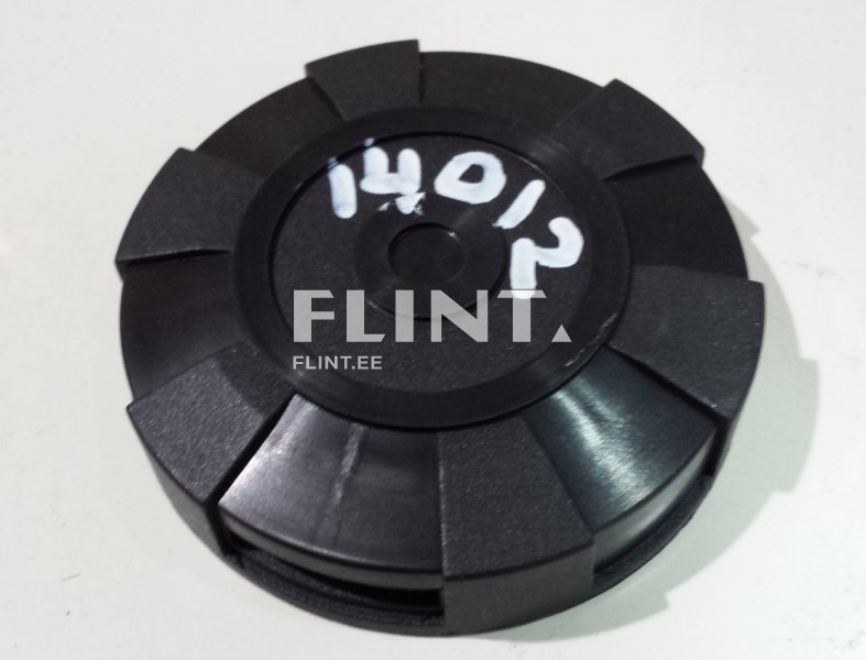 Ümmargune must plastikust kapsel, millel on 12 sälku äärtes. Keskosas on musta värvi nupp.