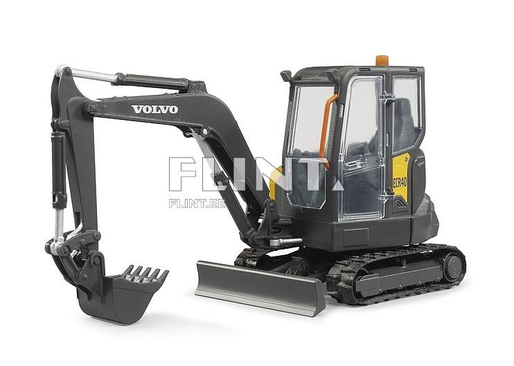 The model is a miniature excavator featuring a black body and a clear cabin. The front has an arm with a bucket attachment and a blade. The tracks are black and designed for maneuvering in tight spaces.