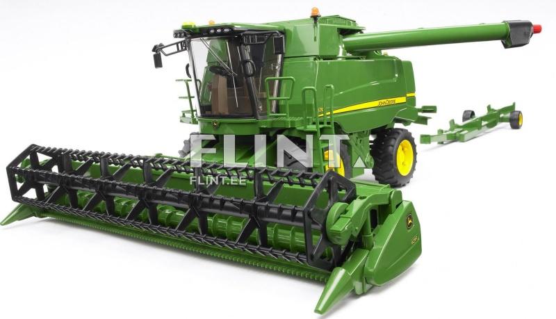 A green combine harvester with a black cutting header at the front. It has one large front wheel and two rear wheels with yellow rims. The harvester is designed for grain harvesting.