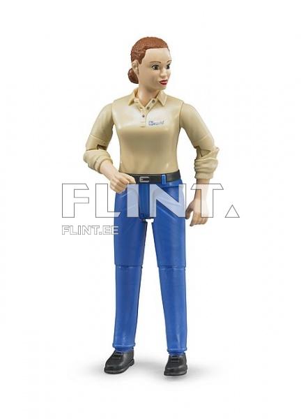 The figurine represents a woman with brown hair wearing a light-colored shirt and blue pants. She stands upright with her left arm slightly bent and her right arm extended to the side.