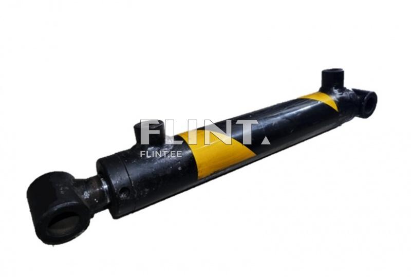 The cylinder has two open ends and is coated in black paint with a yellow stripe. The black ends and openings show signs of corrosion, indicating use.